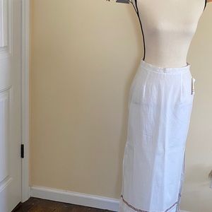 White cotton maxi skirt trimmed in pink flowers.